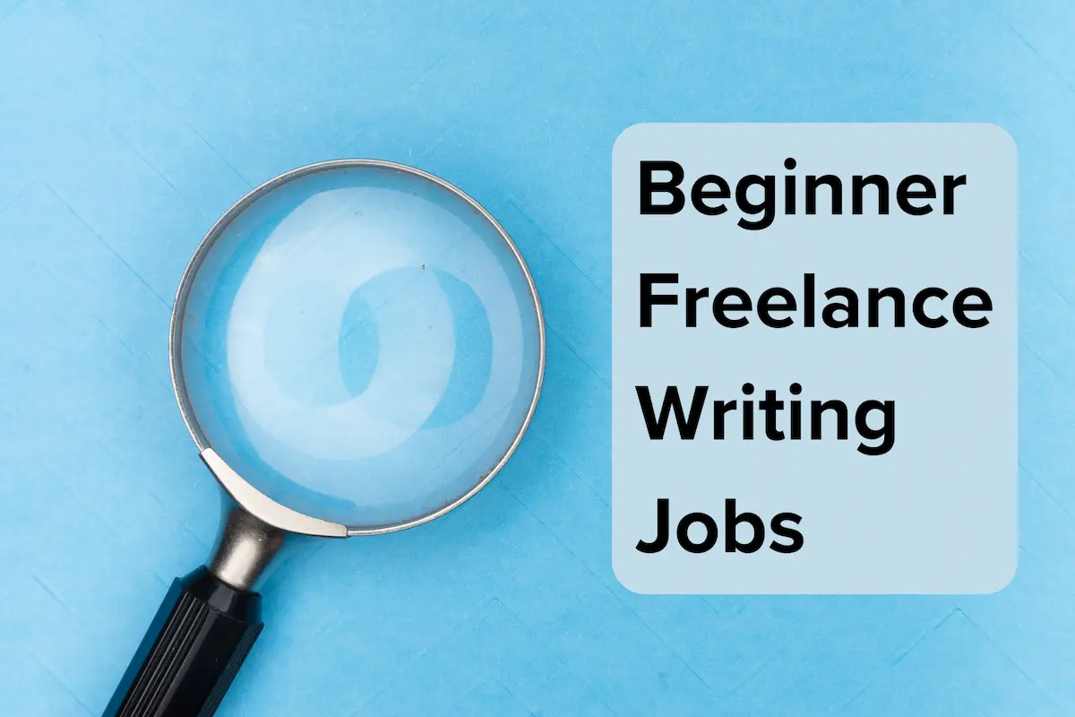 Magnifying glass on a blue background with the text "Beginner Freelance Writing Jobs".