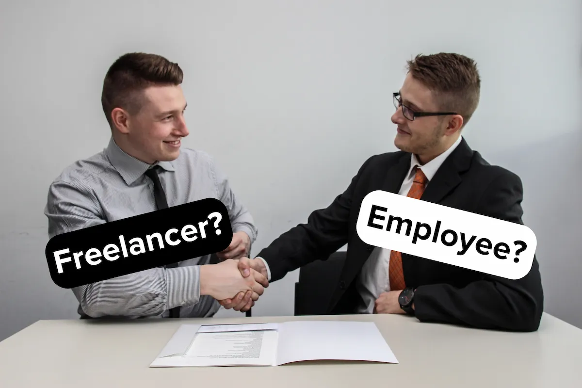 Two men shaking hands with "Freelancer?" on one and "Employee?" on the other.